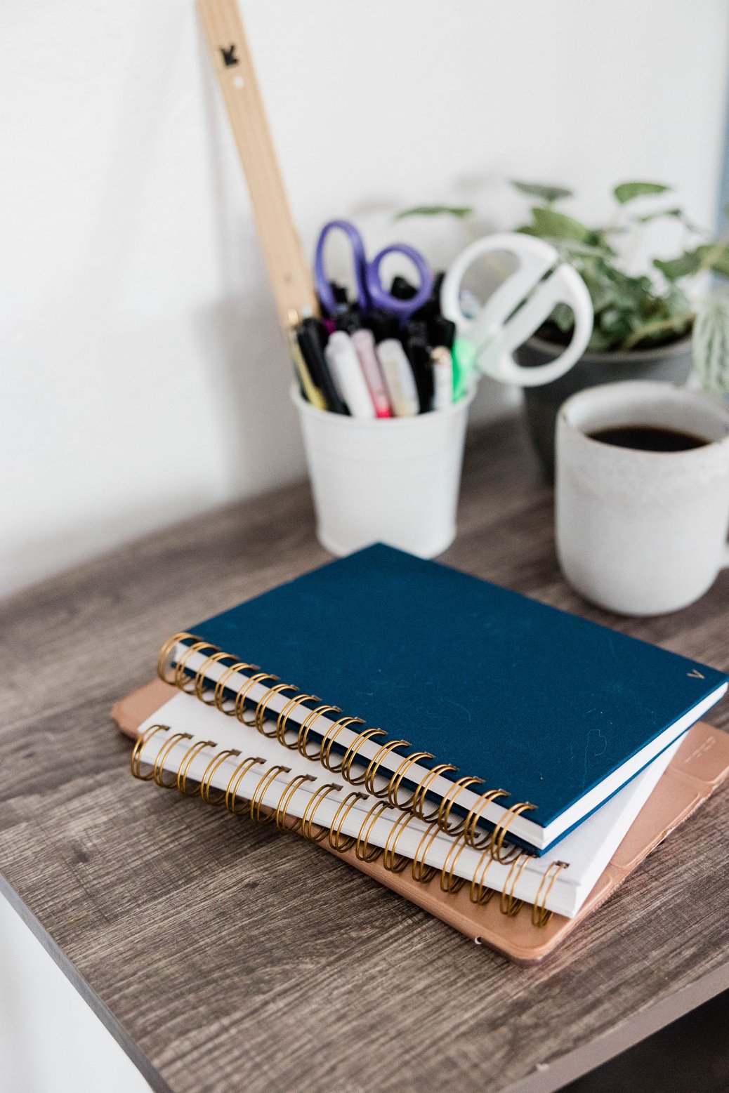 Notebooks on Wooden Desk